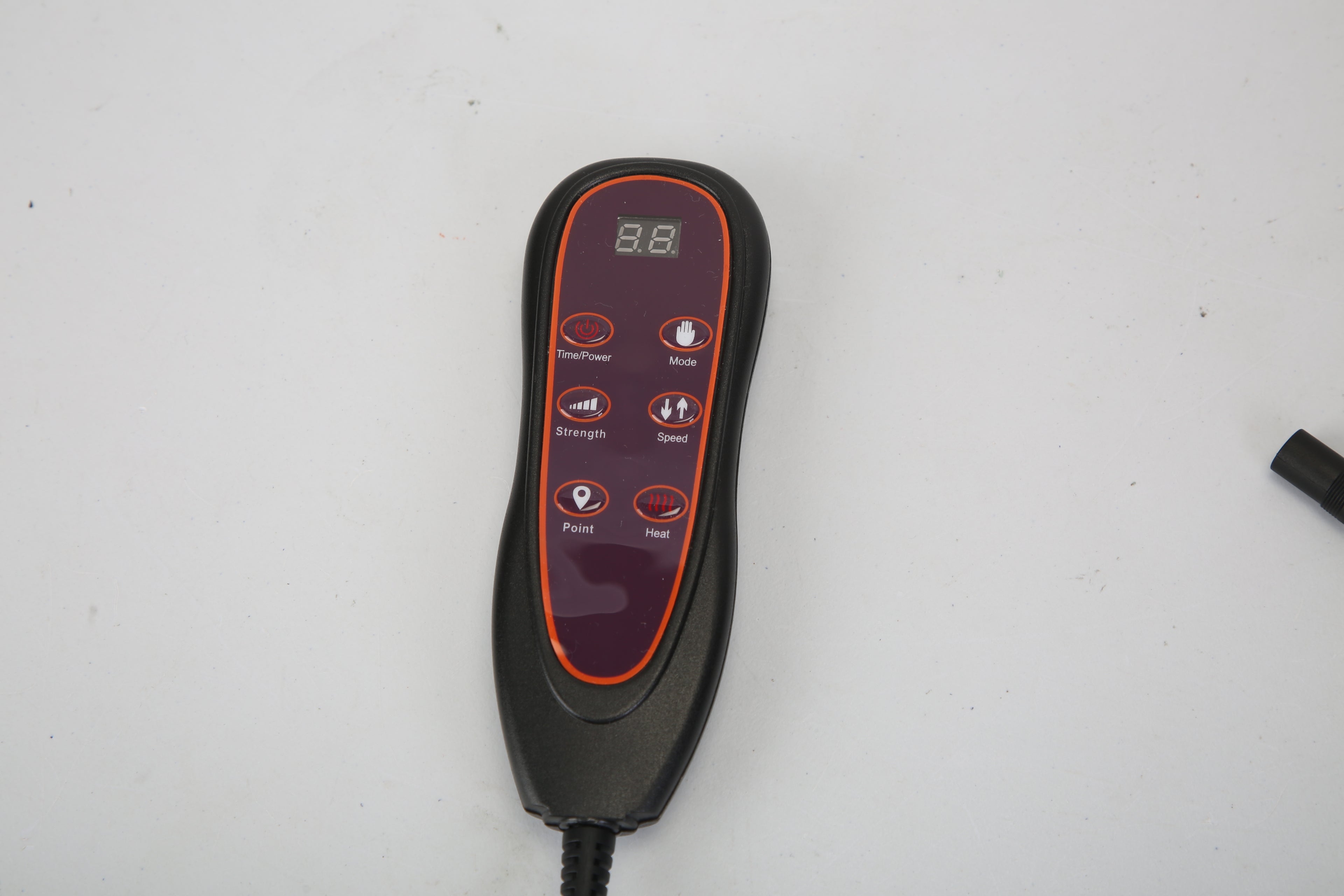 Black handheld controller for massage mat with display and mode, speed, and heat buttons