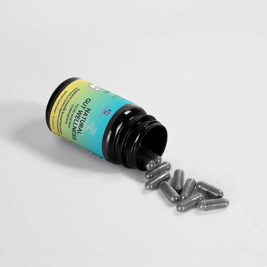 Black supplement bottle tipped on side with clear gray capsules scattered