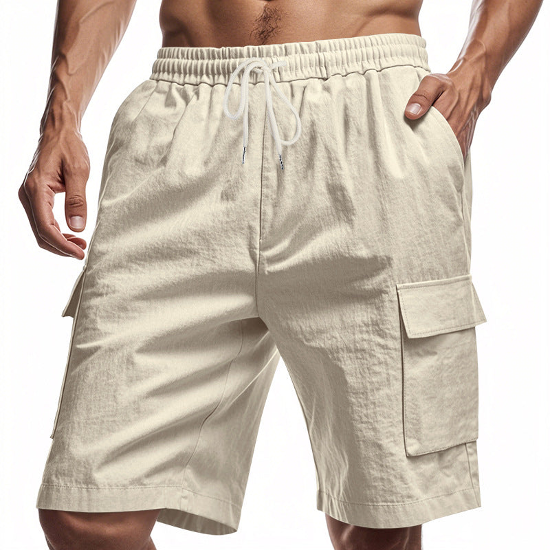 Beige men’s drawstring cargo shorts with elastic waistband and side flap pockets