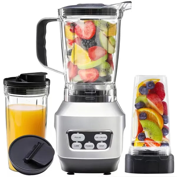 Silver countertop blender with clear pitcher, fruit contents, and storage cups with lids