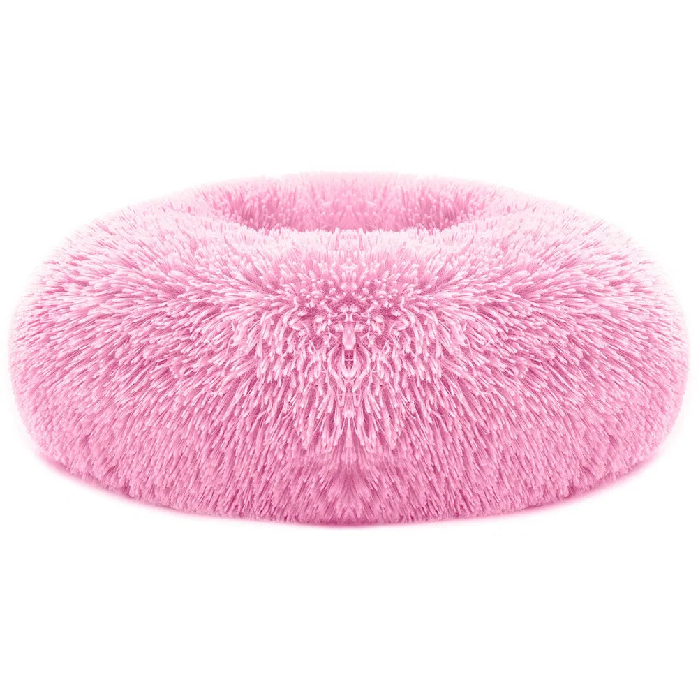 Pink plush oval pet sofa bed with shag fleece texture and raised center