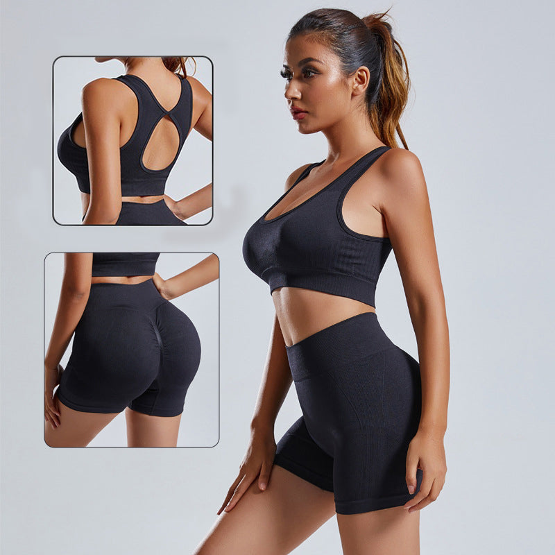 Black 2-piece yoga set with crisscross back sports bra and high-waist shorts