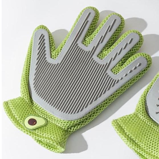 Green pet grooming glove close-up with striped silicone massage bristles