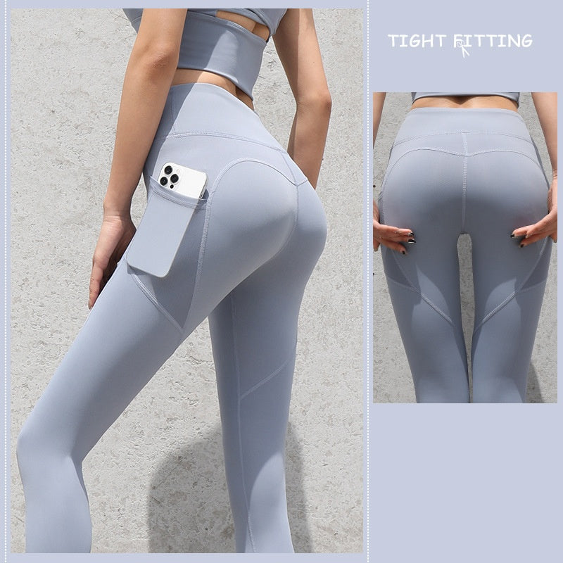 High-waist seamless leggings in pale gray-blue with side phone pocket, front and back views