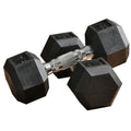 Black hex rubber dumbbells with textured finish and knurled center handle