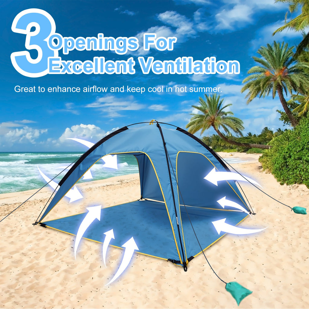 Blue beach tent canopy on sand with open doorway panels and outer guy ropes.