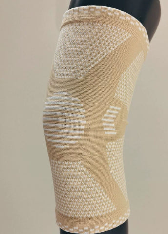 Beige sports compression knee sleeve with white ribbed support stripes