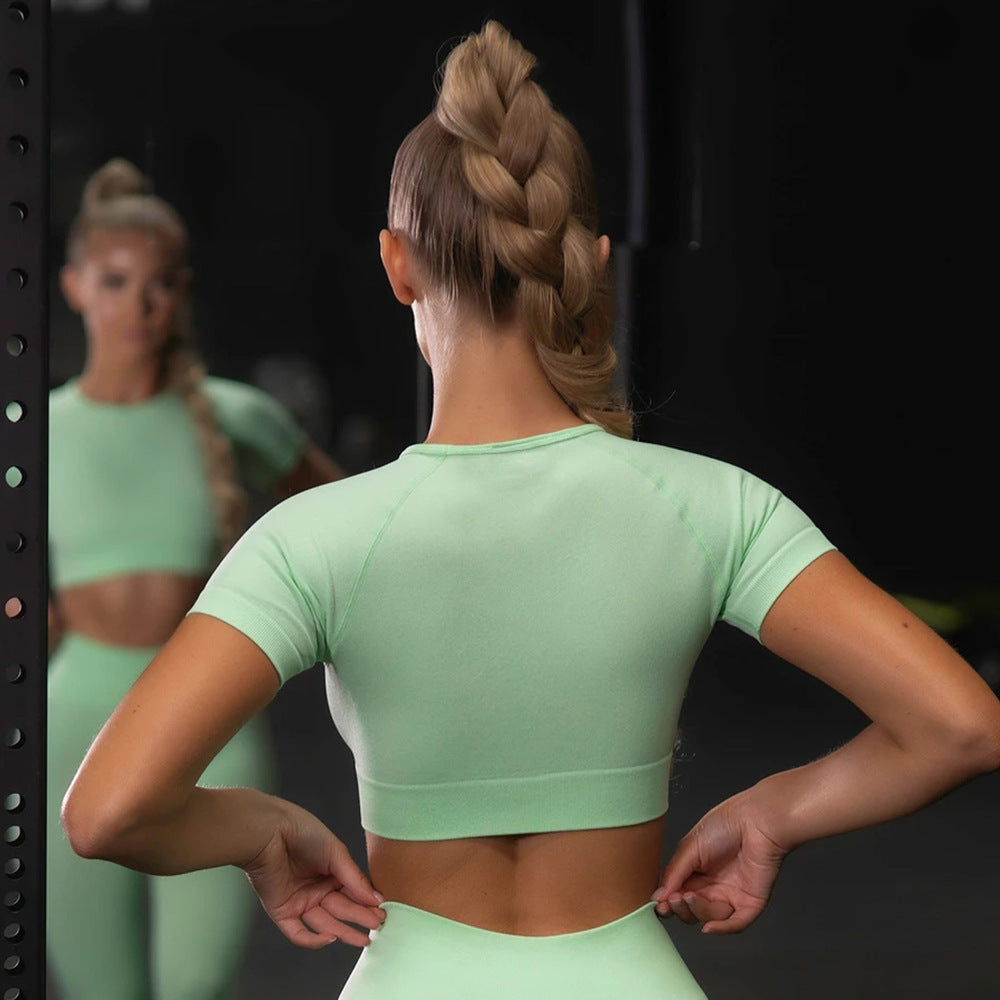 Mint green seamless workout set with short-sleeve crop top and high-waist leggings (back view)