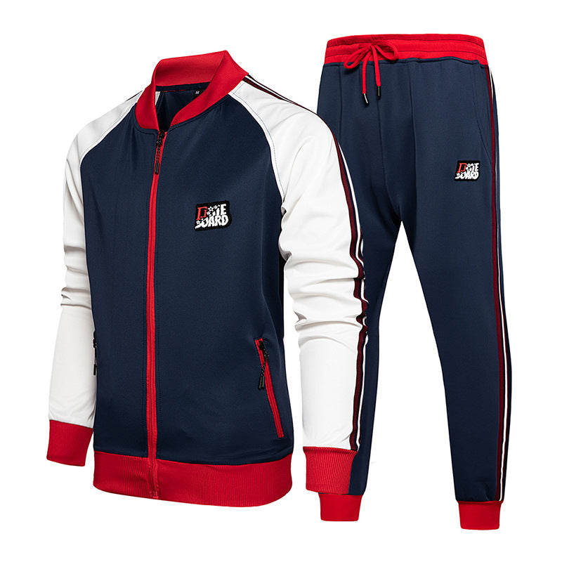 White and navy colorblock tracksuit with red zipper trim, zip jacket and jogger pants