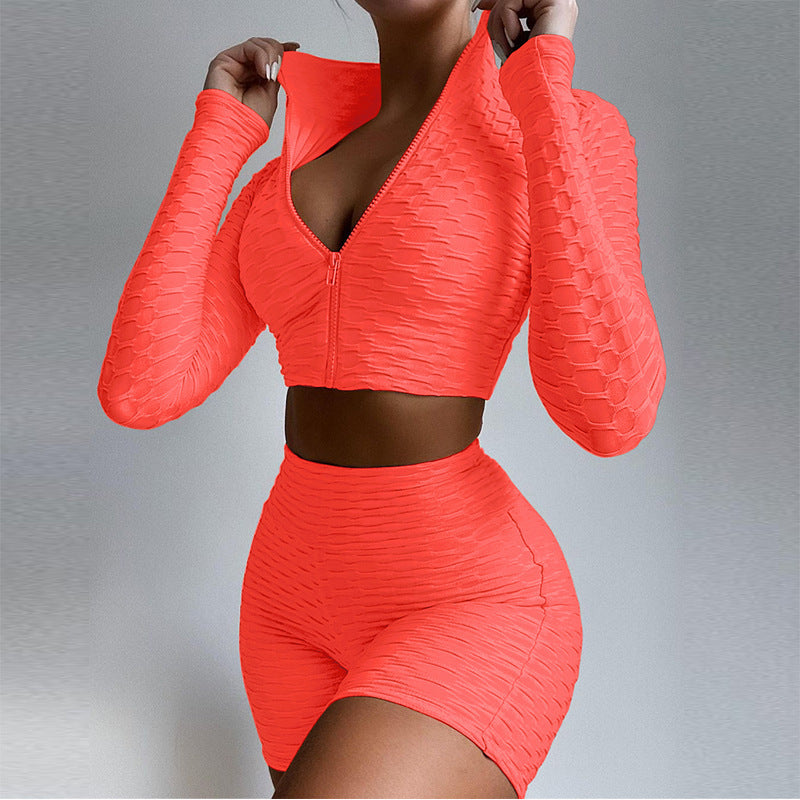 Women's zip-front crop top and biker shorts set, bright red textured fabric