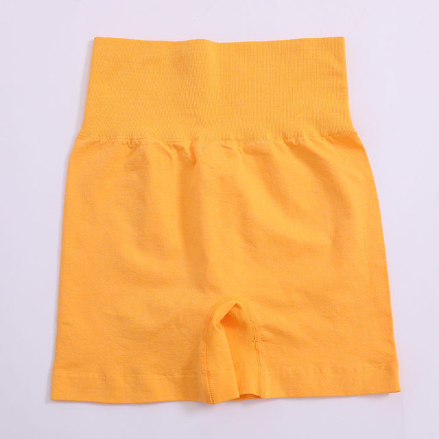 Women’s high-waist yoga shorts, solid yellow, gathered waistband, inner pocket seam