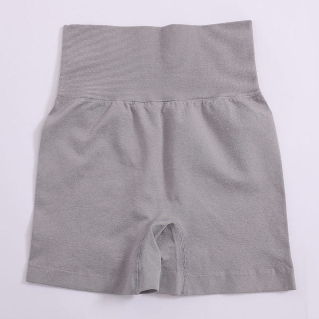 Women’s high-waist push-up yoga shorts in light grey heather, flat lay back view