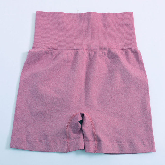 Women’s high-waist push-up yoga shorts in dusty pink, flat lay back view