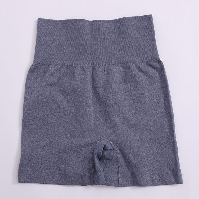 Women’s high-waist yoga shorts, solid dark blue, gathered waistband, inner pocket seam