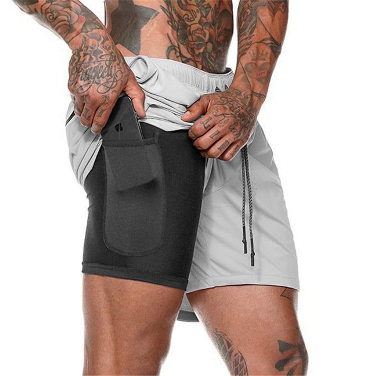Men's athletic shorts in light gray/white with large front pocket and drawstring ties