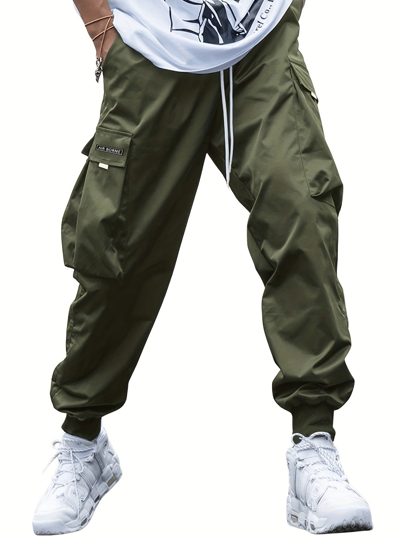 Dark green cargo pants with drawstring waist and stacked side utility pockets
