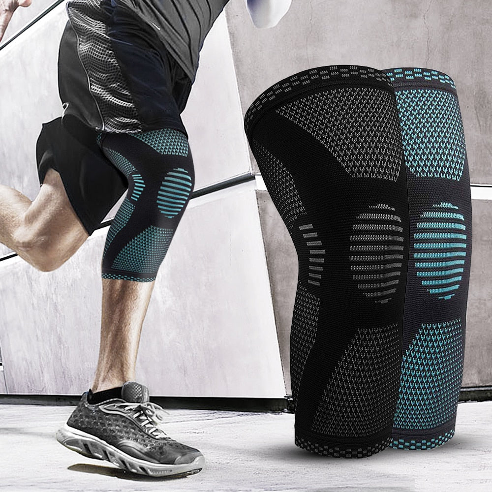 Pair of black sports knee compression sleeves with teal striped support panels