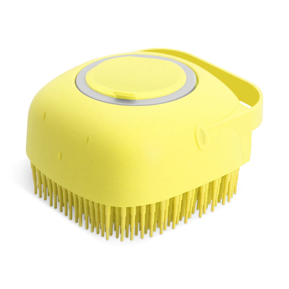 Yellow silicone pet bath brush with dense massage bristles and circular flip-top dispenser
