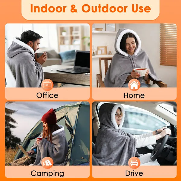Grey hooded heated throw blanket worn by a person while holding a cup