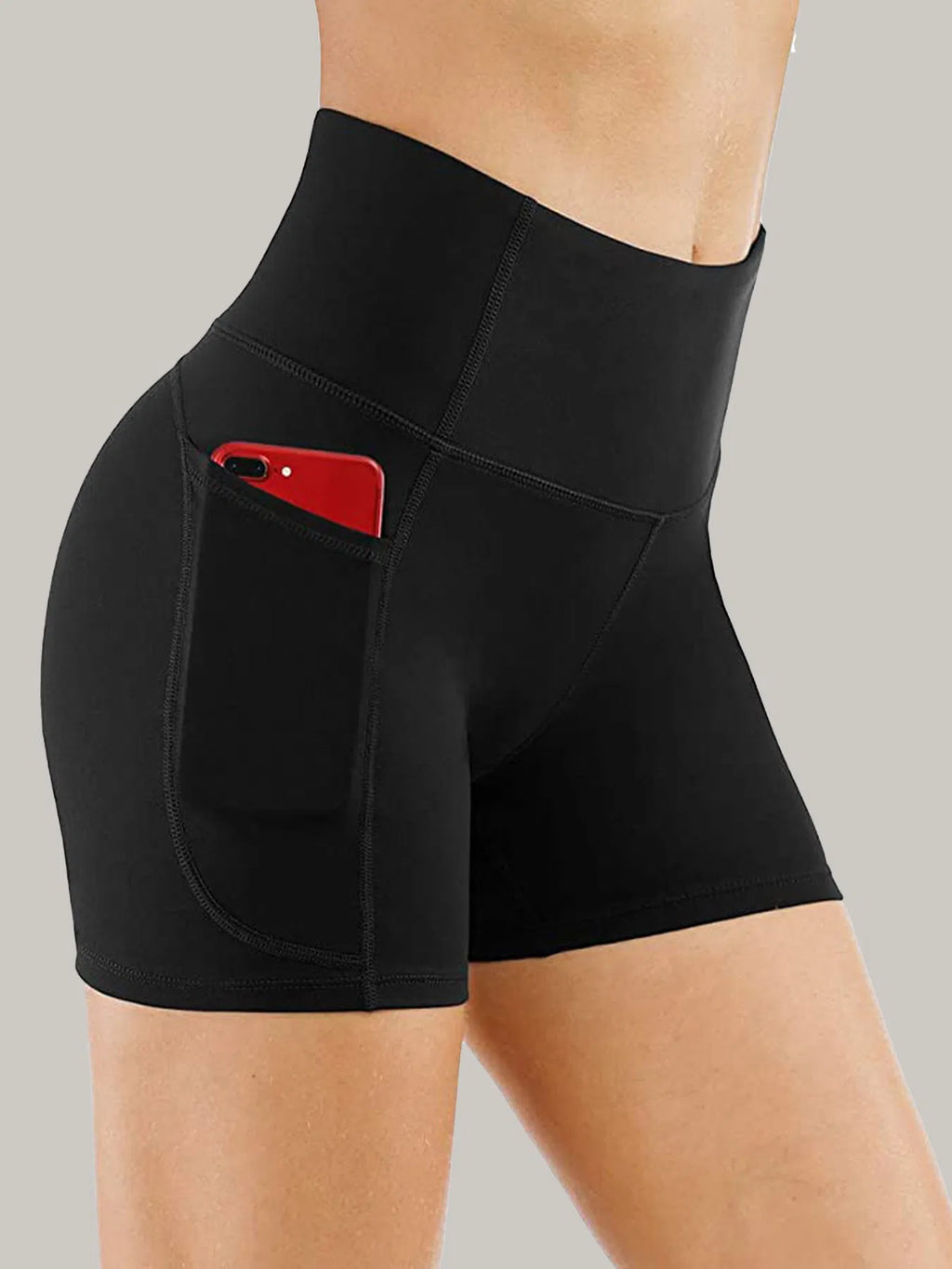 Black biker shorts with side pocket and curved seam stitching