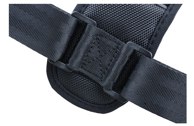 Adjustable support strap with mesh-textured padding and plastic buckle, dark gray.