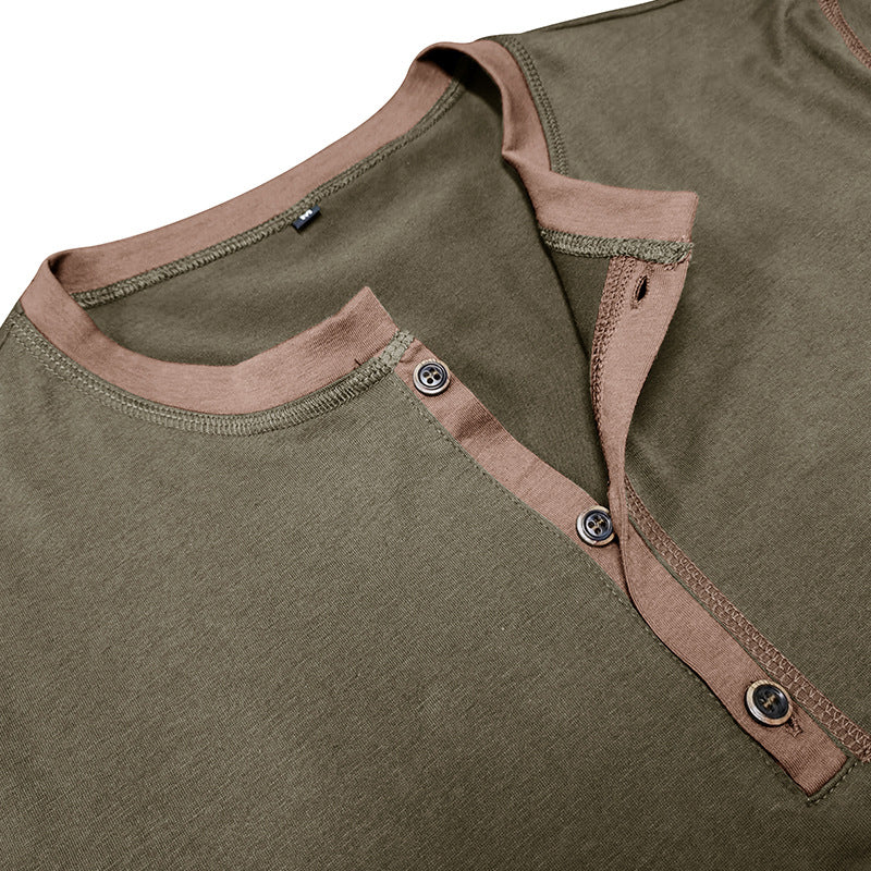 Close-up: army green henley V-neck T-shirt with pink trim and button placket