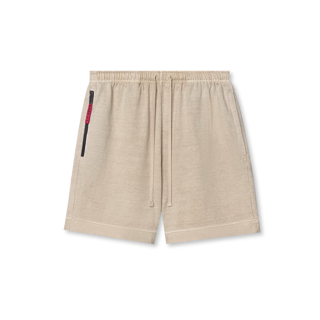Light beige shorts with elastic waistband, drawstring, and side zip pocket