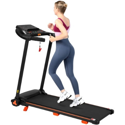 Black treadmill with console and orange feet, woman walking side view