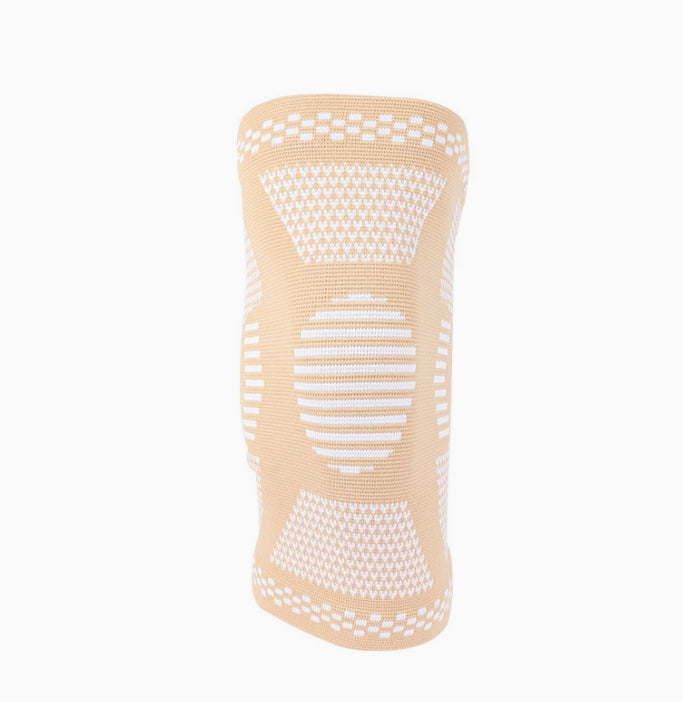 Beige sports compression knee sleeve with white support pattern and grippy top edge