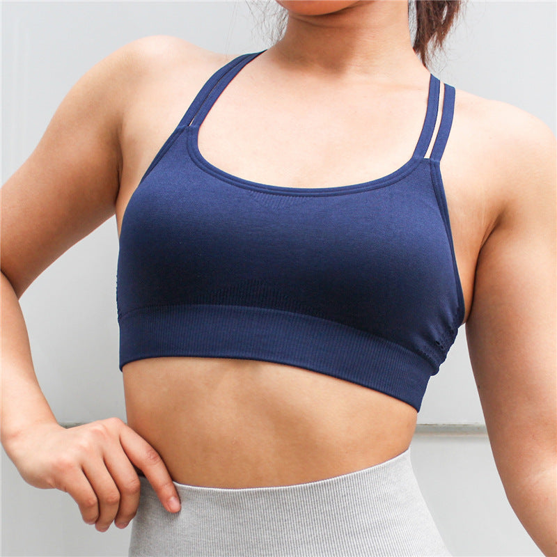 Blue padded sport bra with racerback straps and wide ribbed hem