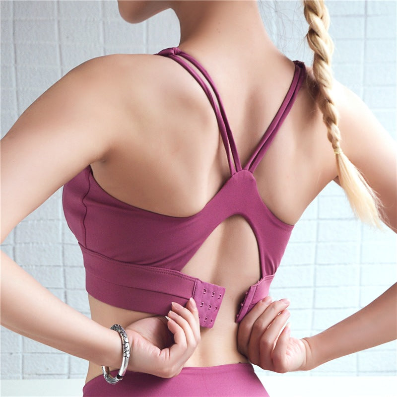 High-support sports bra, rose-pink with open-back strappy design and hook closure
