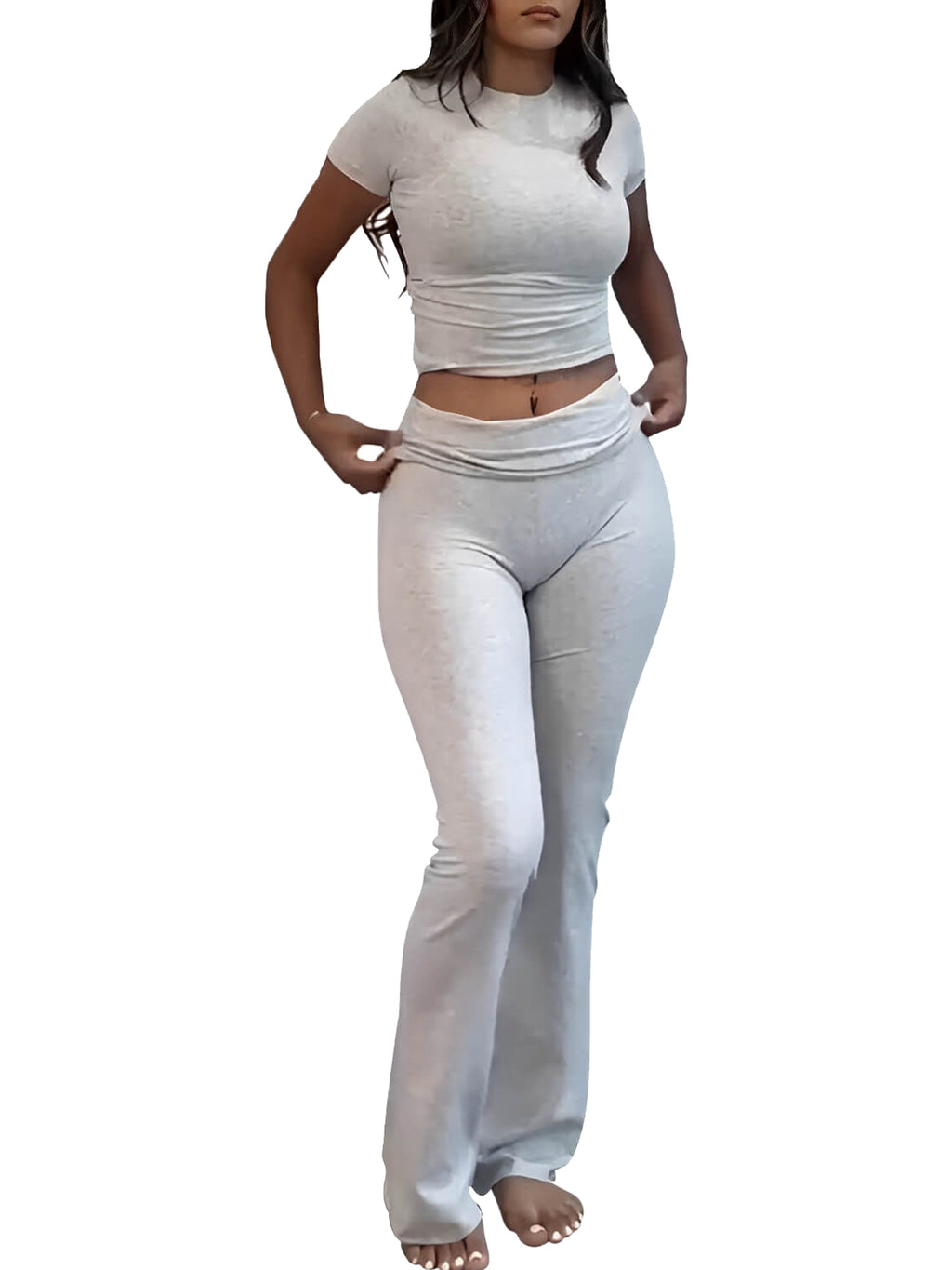 Light-colored flare yoga pants with fold-over high waist and wide bell legs, full front