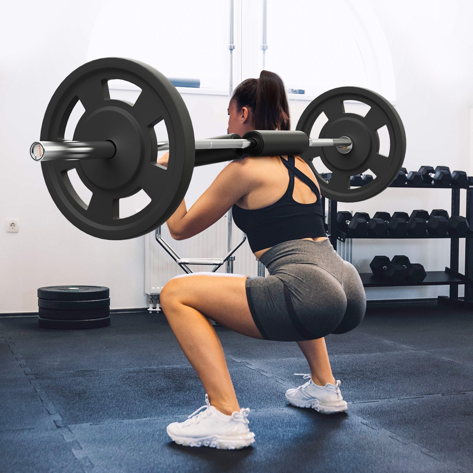 Safety squat bar with black padded shoulder rests and lifting handles