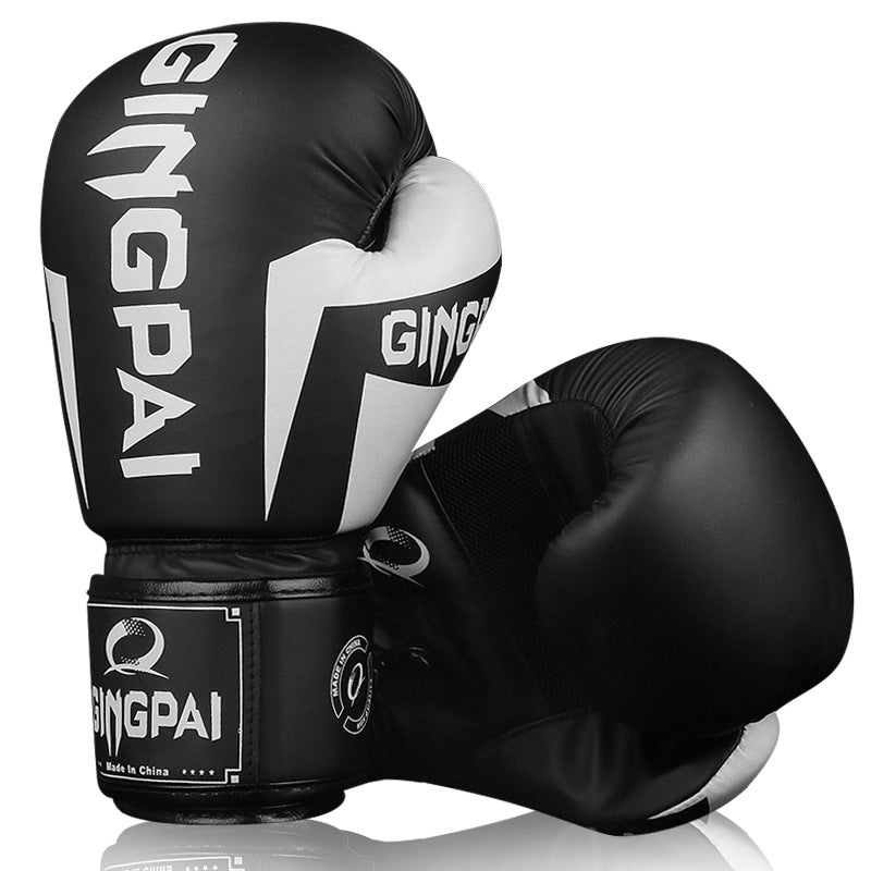 Boxing training gloves in black and white with bold contrast wrist branding
