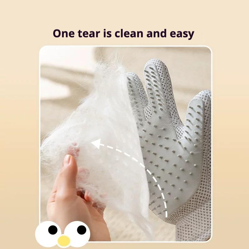 Gray deshedding glove brushing loose fur with silicone bristle surface