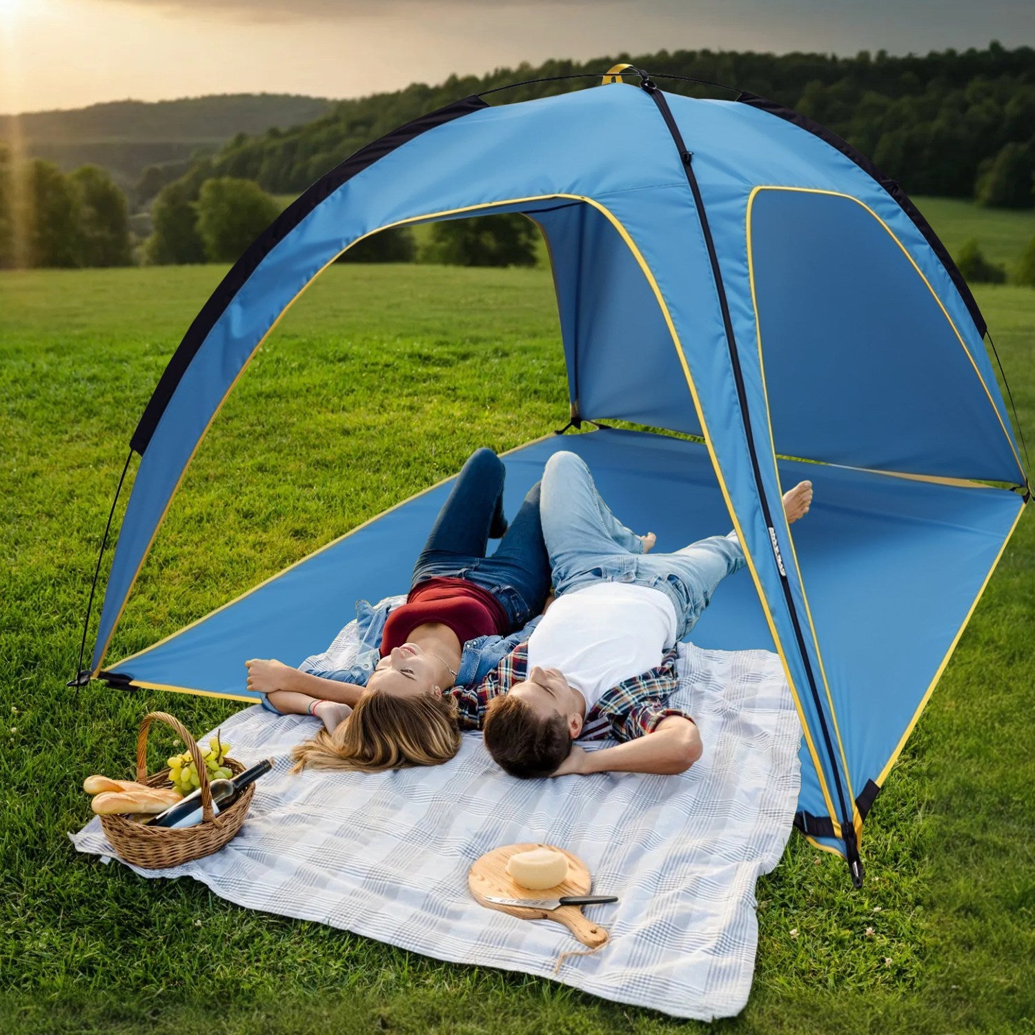 Blue beach tent with arched doorway and side panels, set up on grass for lounging.
