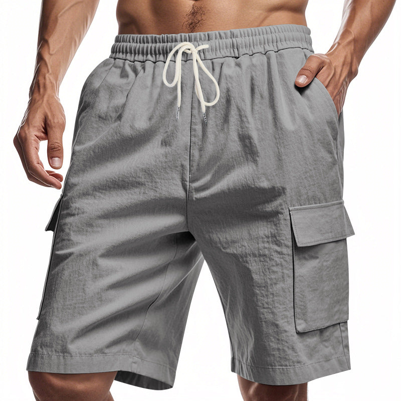Gray men’s drawstring cargo shorts with elastic waistband and side utility flap pockets