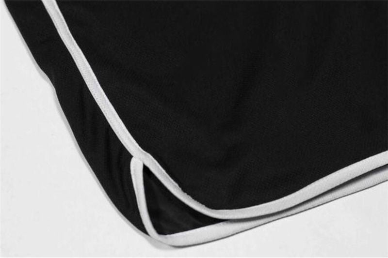 Men's quick-dry mesh fitness shorts, black with white contrast piping along hem