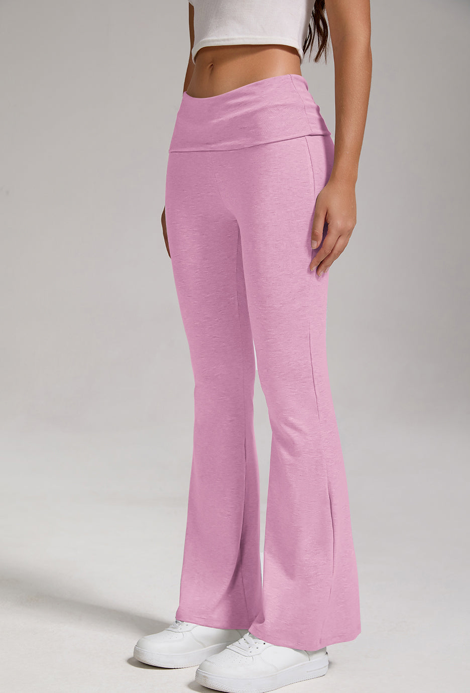 Pink fold-over high-rise flare leggings with wide bell-bottom legs