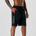 Black quick-dry running shorts with elastic waistband and drawstring, side zip pocket.