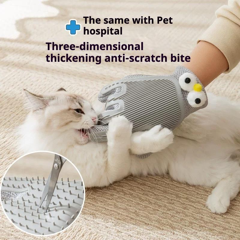 Gray pet grooming glove with comb and massage silicone surfaces on a cat