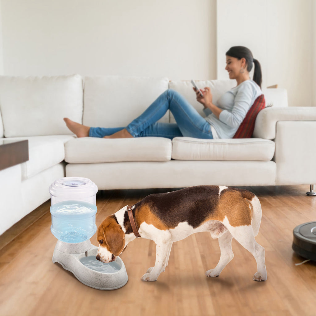 Gravity pet water dispenser with clear container and speckled light gray base, ready to drink