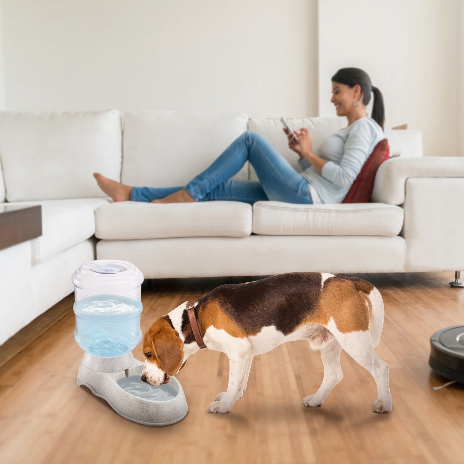 Gravity pet water dispenser with clear container and speckled light gray base, ready to drink