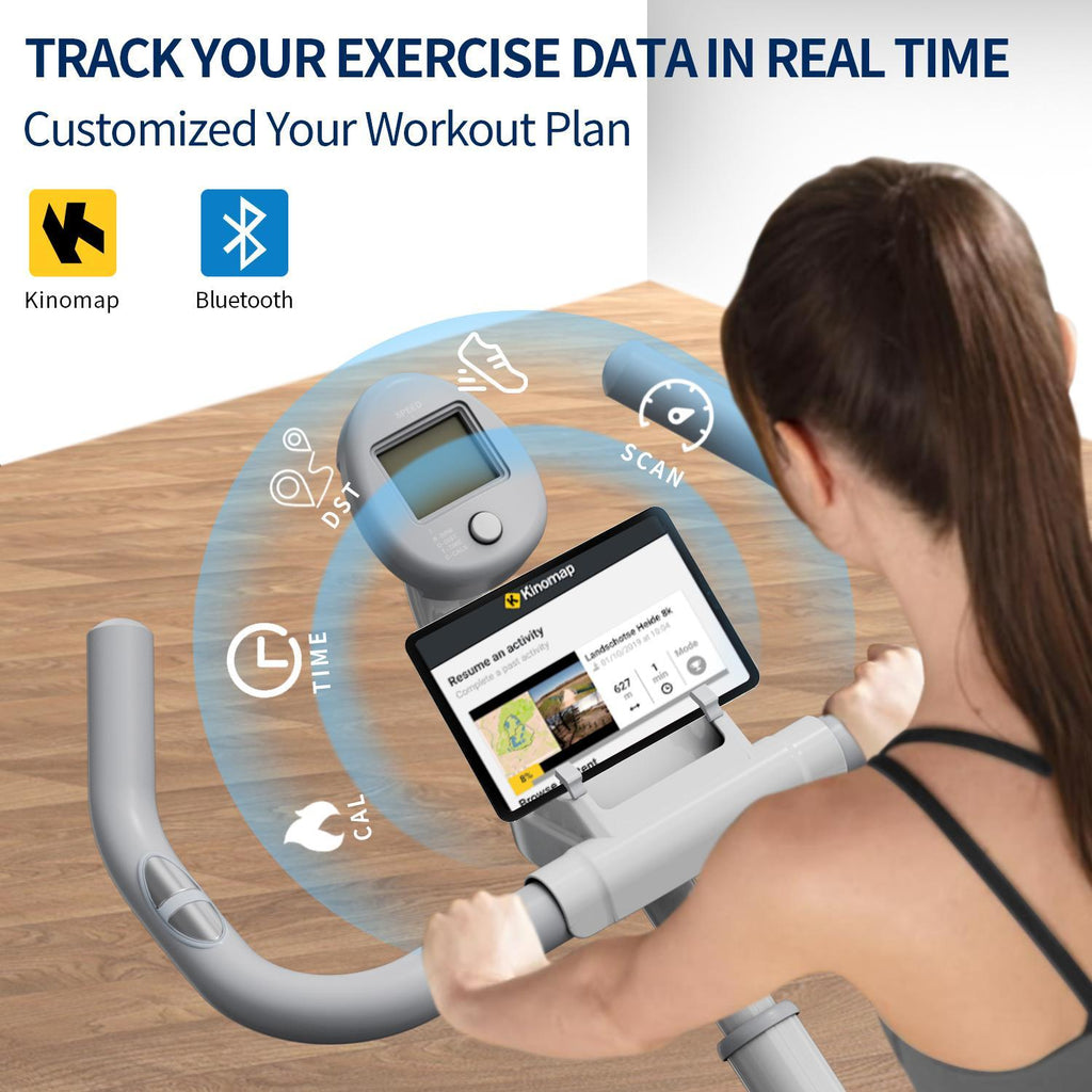 Spin bike display console with user hands on handlebars during indoor workout
