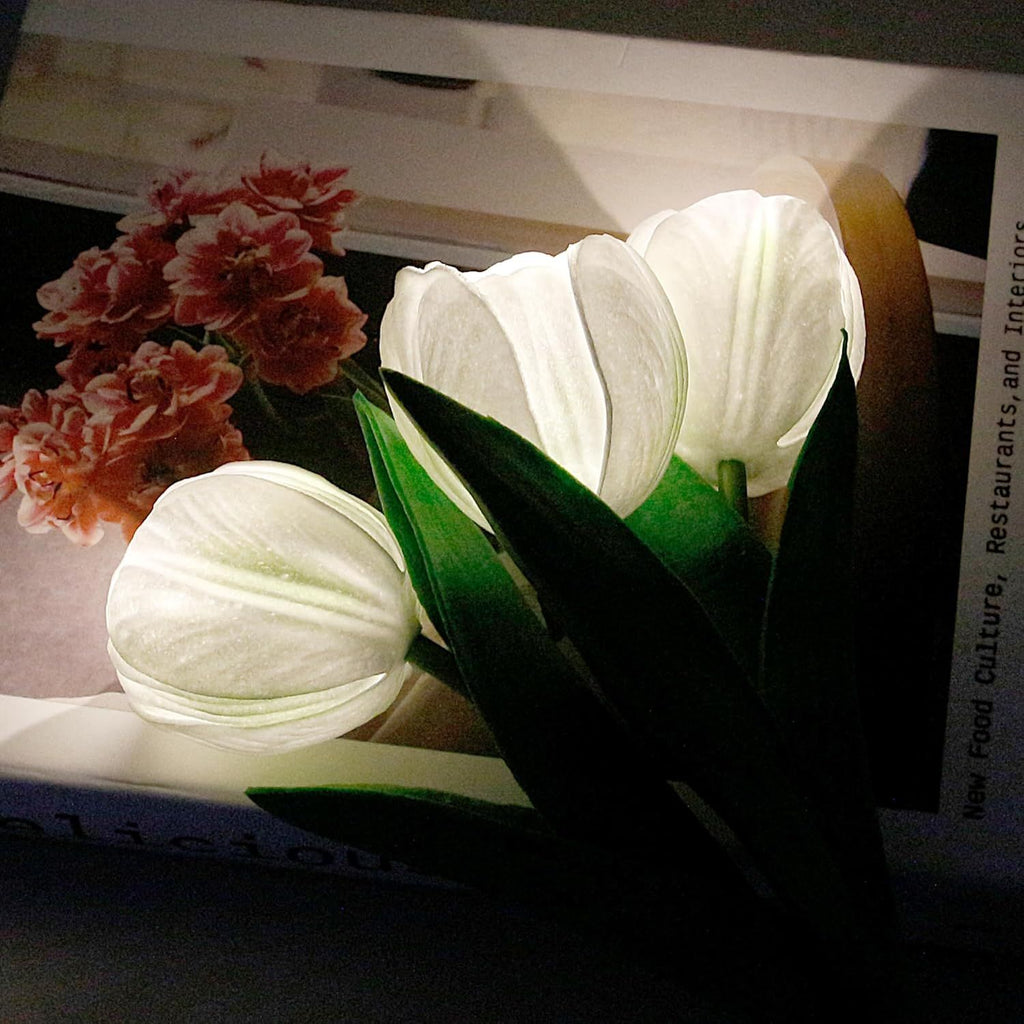 LED tulip table lamp with glowing white petals and green stems in a vase base.