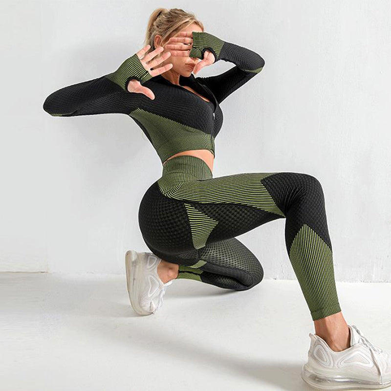 Olive and black seamless 3-piece workout set with striped panels: zip crop top and leggings.