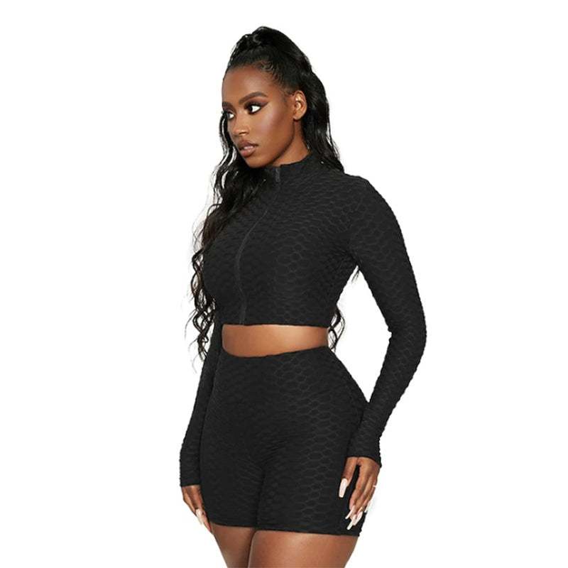 Black long-sleeve zipless crop top and matching high-waist shorts tracksuit set