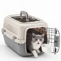 Hard-sided pet carrier with top handle, ventilated top, and front wire door, beige and gray