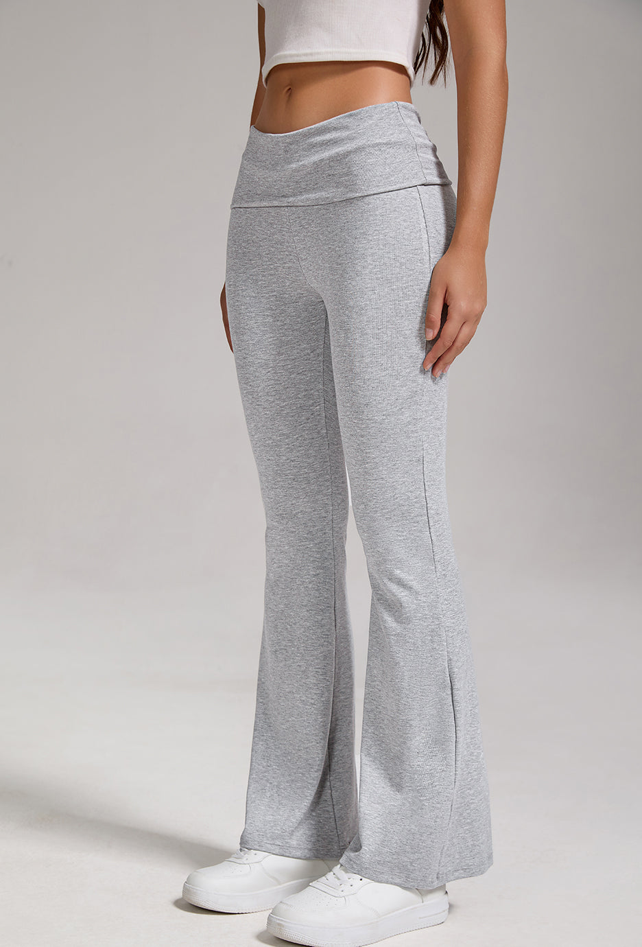 Heather grey fold-over high-rise flare leggings with wide bell hem, back/side view