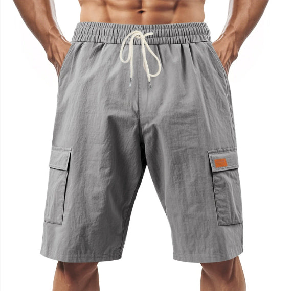 Gray men’s cargo shorts with drawstring waist and side flap pockets, knee length